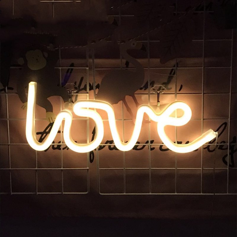 Neon Light Shape Neon Light Shape displayed in a festive scene with various light shapes on decorative trees.